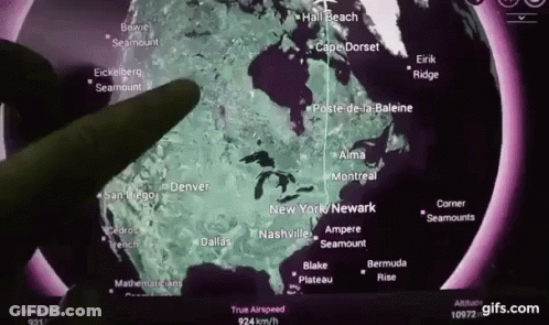 A Person Is Pointing At A Map Of The United States And Canada GIF