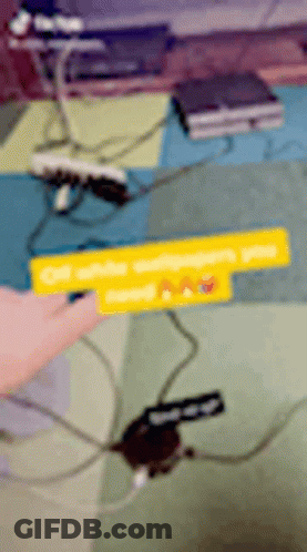 A Person Is Pointing At A Sign That Says Off White GIF