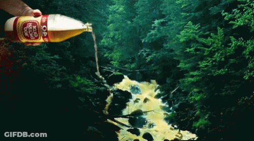 A Person Is Pouring A Bottle Of Dr Pepper Into A Stream GIF
