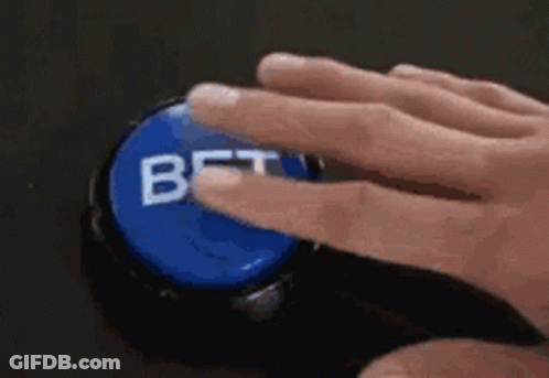 A Person Is Pressing A Bet Button With Their Finger . GIF