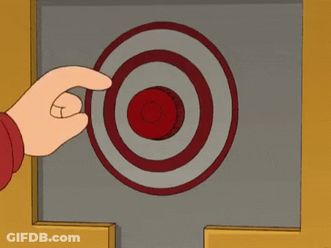 A Person Is Pressing A Red Button With A Target In The Background GIF