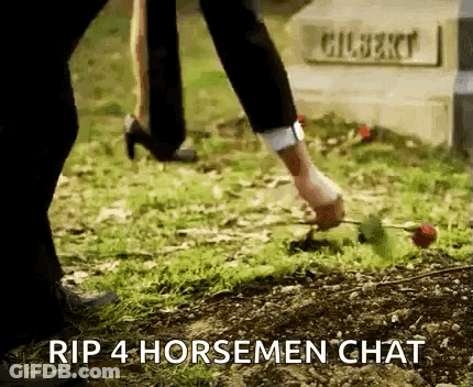 A Person Is Putting A Rose In The Ground Next To A Grave . GIF