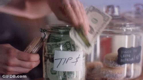 A Person Is Putting Money Into A Jar Labeled Tip $ GIF
