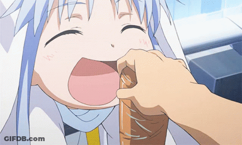A Person Is Putting Something In A Child 'S Mouth With The Letter W On It GIF