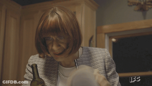 A Person Is Reading A Book With The Letters Lfc On The Back Of Their Jacket GIF
