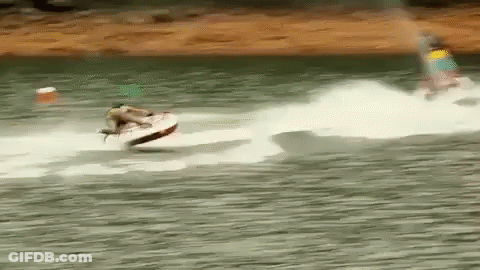 A Person Is Riding A Jet Ski On A Body Of Water . GIF