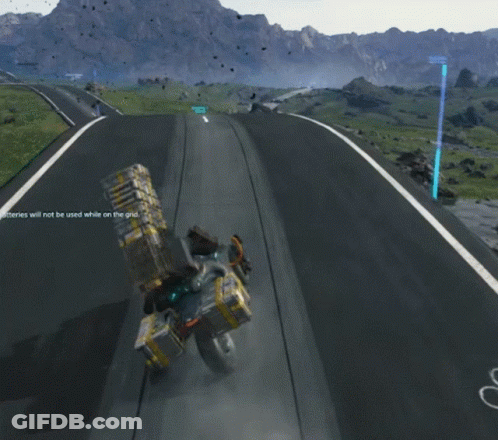 A Person Is Riding A Motorcycle Down A Road With Mountains In The Background And The Number 1 On The Right GIF