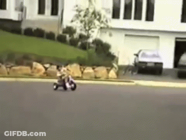 A Person Is Riding A Motorcycle Down A Street GIF