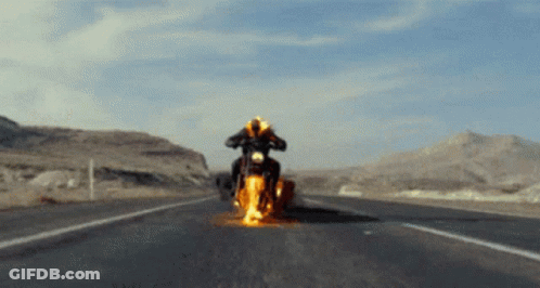 A Person Is Riding A Motorcycle On A Highway GIF