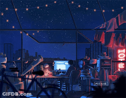 A Person Is Sitting At A Desk With A Computer And A Telescope In Front Of A Hotel Sign . GIF