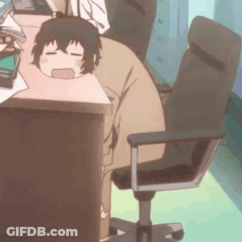 A Person Is Sitting At A Desk With Their Head On A Desk . GIF