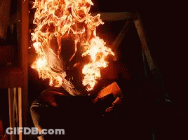 A Person Is Sitting In A Room With A Lot Of Fire Coming Out Of Their Body . GIF