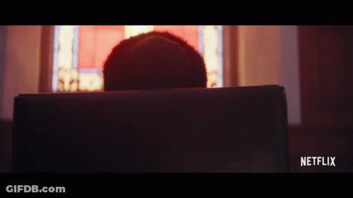 A Person Is Sitting In Front Of A Laptop With Netflix Written On The Bottom Right GIF