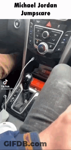 A Person Is Sitting In The Driver 'S Seat Of A Car With A Caption That Says Michael Jordan Jumpscare GIF