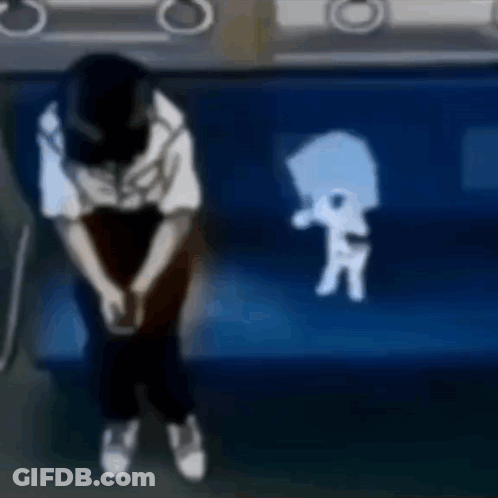 A Person Is Sitting On A Blue Couch With A Shadow Of A Person On The Couch . GIF