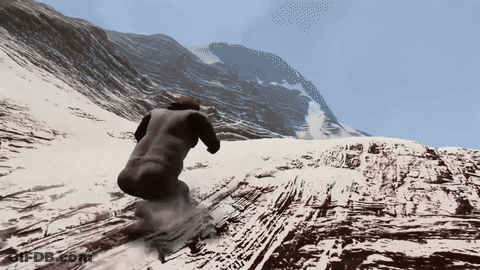 A Person Is Skiing Down A Snow Covered Hill GIF