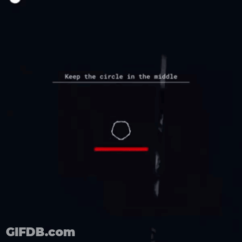 A Person Is Standing In A Dark Room With A Circle In The Middle Of The Screen . GIF