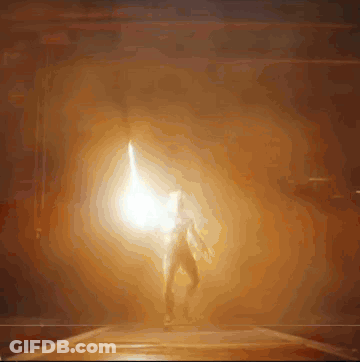 A Person Is Standing In A Dark Room With A Lightning Bolt GIF