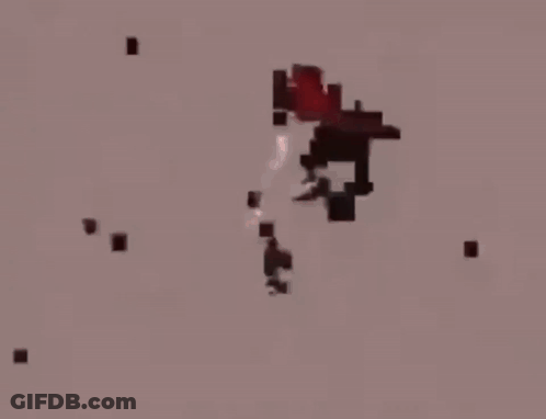 A Person Is Standing In A Dark Room With A Red Light Coming From The Ceiling . GIF