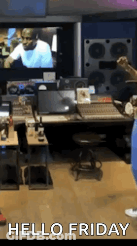 A Person Is Standing In A Room With The Words Hello Friday Written On It GIF