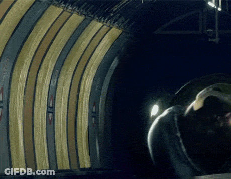 A Person Is Standing In A Tunnel With A Sign On The Wall That Says ' A ' GIF