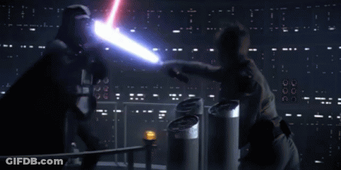 A Person Is Standing In Front Of A Blue Light That Is Shining On Them GIF