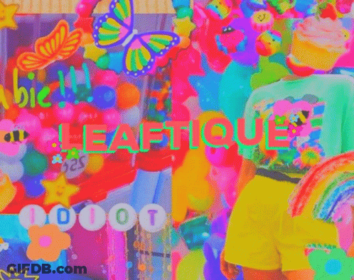 A Person Is Standing In Front Of A Colorful Wall With Balloons And The Word Leafique On It . GIF