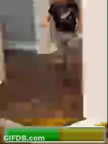 A Person Is Standing In Front Of A Dresser In A Room With A Green Screen . GIF
