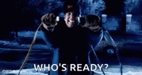 A Person Is Standing In Front Of A Fire With The Words `` Who 'S Ready ? '' . GIF