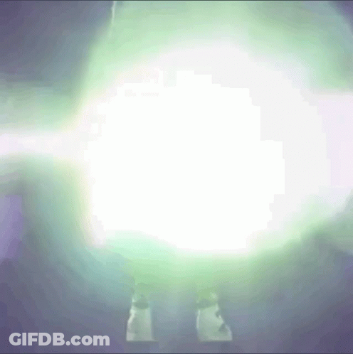 A Person Is Standing In Front Of A Glowing Light GIF