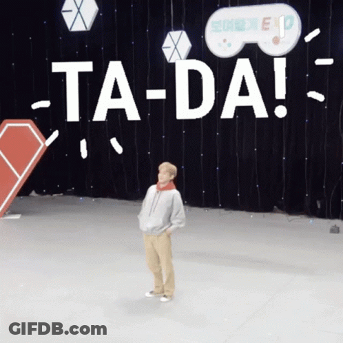 A Person Is Standing In Front Of A Sign That Says Ta-Da GIF