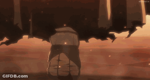 A Person Is Standing In The Middle Of A Desert With A Huge Explosion Coming Out Of It . GIF