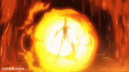 A Person Is Standing In The Middle Of A Large Fireball . GIF