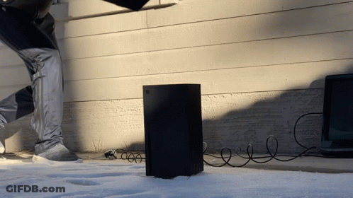 A Person Is Standing Next To A Black Box That Is Plugged Into A Wall GIF