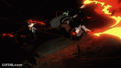 A Person Is Standing On A Rock With A Red Light Behind Them GIF