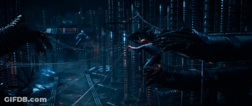 A Person Is Standing On A Wire With A Blue Light Coming From It GIF