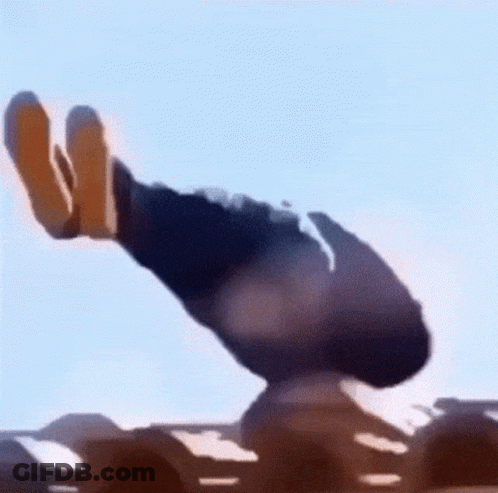 A Person Is Standing On Top Of A Sand Dune In The Desert With A Blue Sky In The Background . GIF