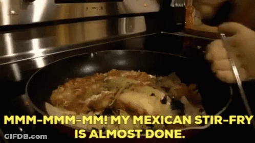 A Person Is Stirring A Mexican Stir Fry In A Frying Pan On A Stove GIF