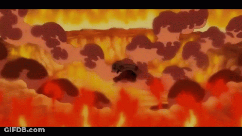 A Person Is Surrounded By Flames And Smoke GIF