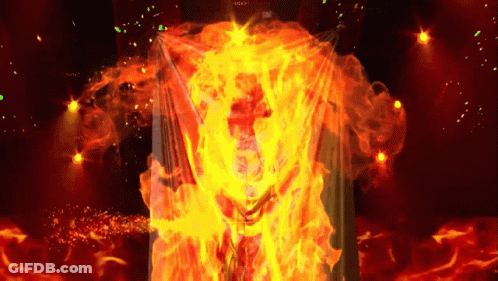 A Person Is Surrounded By Flames And The Word Rock Is Visible On The Screen GIF
