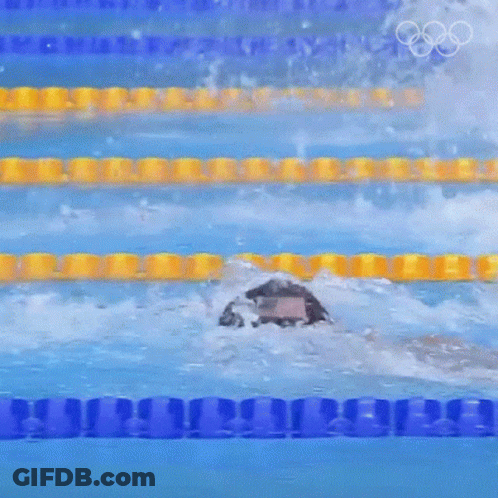 A Person Is Swimming In A Pool With The Olympic Rings Visible GIF