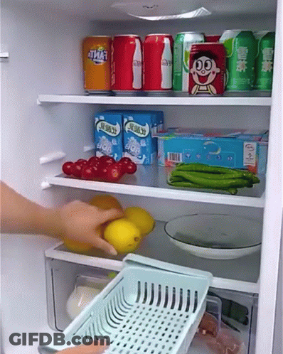 A Person Is Taking A Basket Out Of A Refrigerator Filled With Food And Drinks . GIF