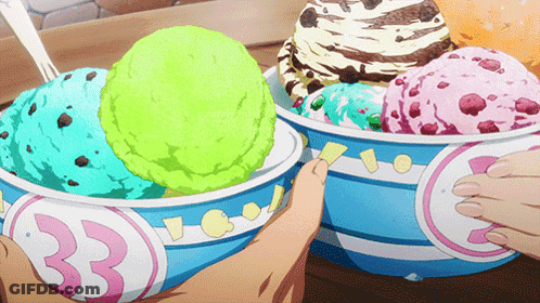 A Person Is Taking A Scoop Of Ice Cream From A Bowl With The Number 33 On It GIF