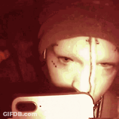 A Person Is Taking A Selfie With A Cell Phone GIF