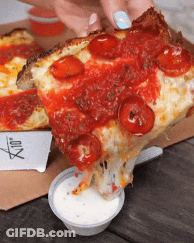 A Person Is Taking A Slice Of Pizza From A Box GIF
