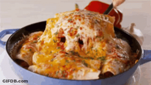 A Person Is Taking A Tortilla Out Of A Pan With Cheese On Top . GIF