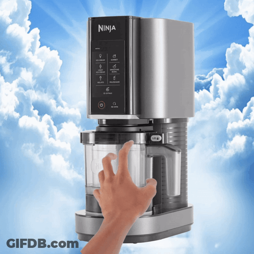 A Person Is Touching A Ninja Coffee Maker With A Blue Sky In The Background GIF