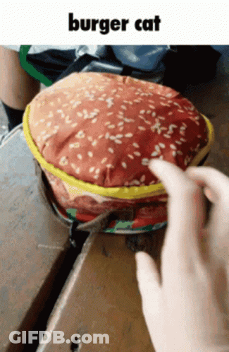 A Person Is Touching A Purse That Looks Like A Burger GIF