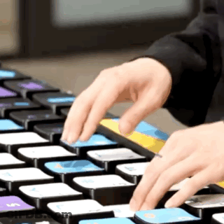A Person Is Typing On A Keyboard With The Letter S On The Bottom Left Corner GIF