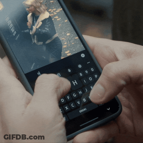 A Person Is Typing On A Phone With A Picture Of A Woman GIF